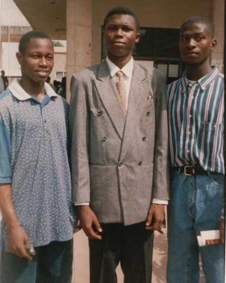 Dr. Olabisi at 17 years old, along with two childhood friends in Nigeria.