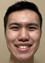 Headshot of Austin Lai smiling at camera in front of white backdrop