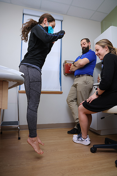 patient jumping to assess agility or injury