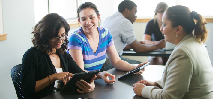 Students looking at tablets