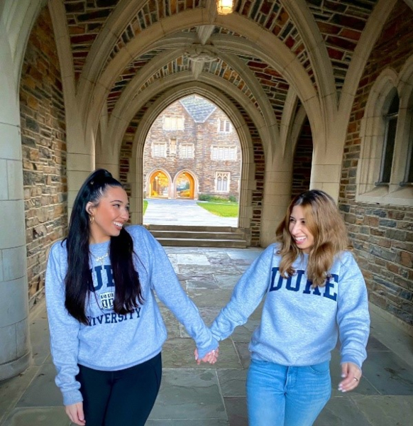 Marissa Barrett-D'Amico and friend holding hands on Duke Campus