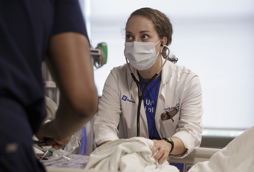 Duke Cardiology fellow Sara Coles, MD, rounding with her team and nurses in the Cardiac Intensive Care Unit at the Duke Medical Pavilion.