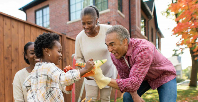 familyt outside together during the fall.