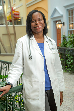 female physician standing outside