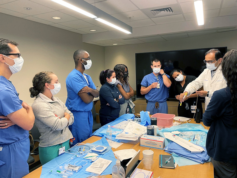 Manesh Patel,MD demonstrates proper technique for placing temporary venous pacemakers and pulmonary artery catheters to Duke Cardiology fellows.