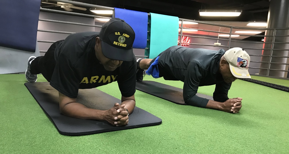 two men doing planks