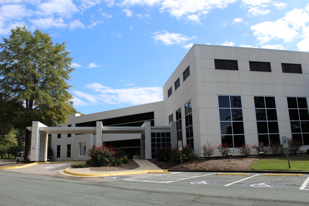 White Business building with empty parking lot