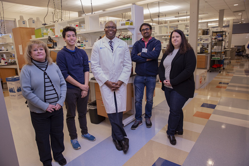 Dr. Olabisi with his lab group in the Duke Molecular Physiology Institute.