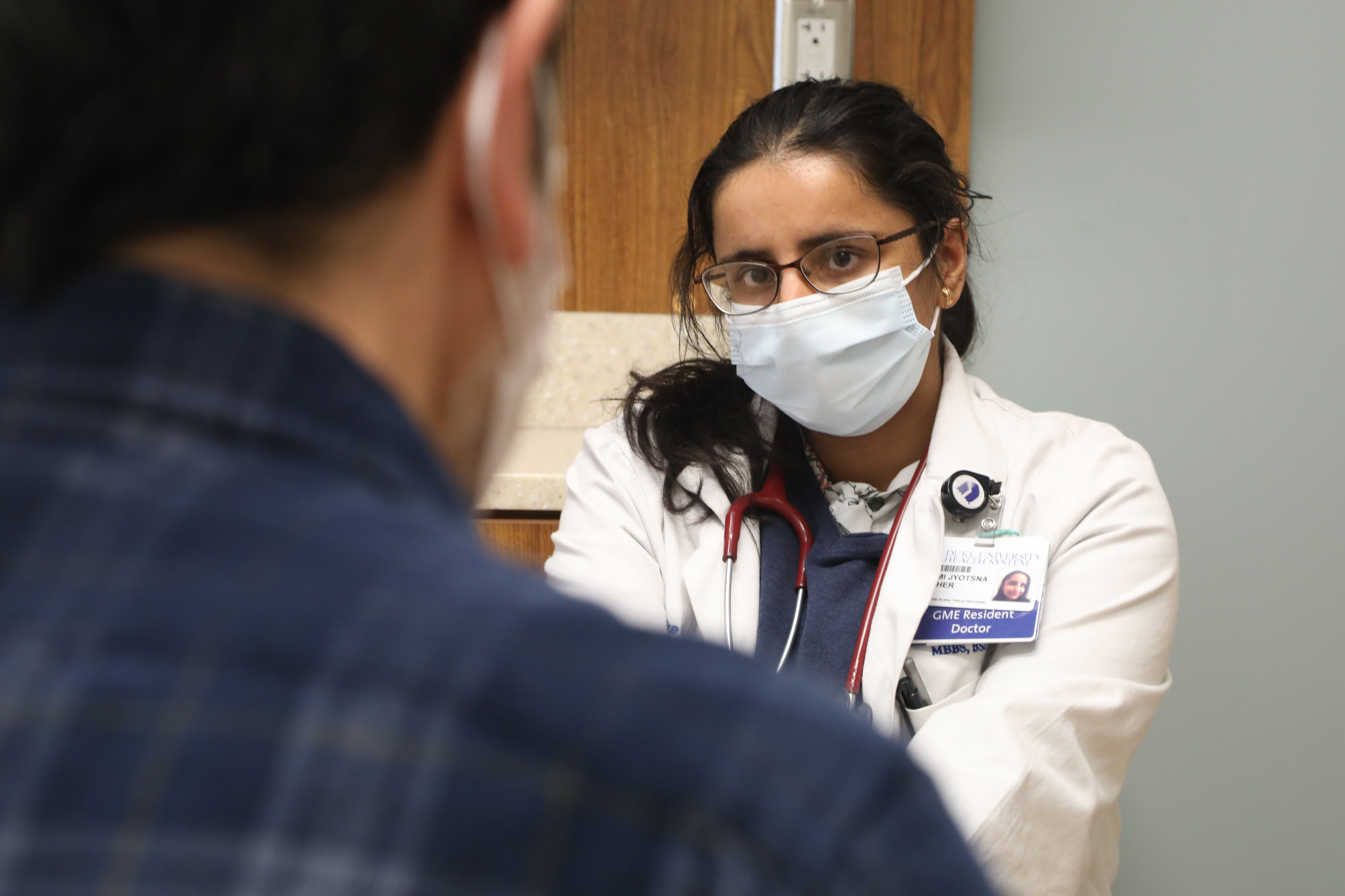 physician speaks with patient