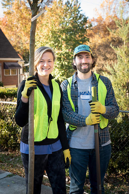 two students planting trees