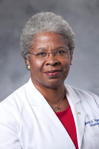 photo of woman in white coat