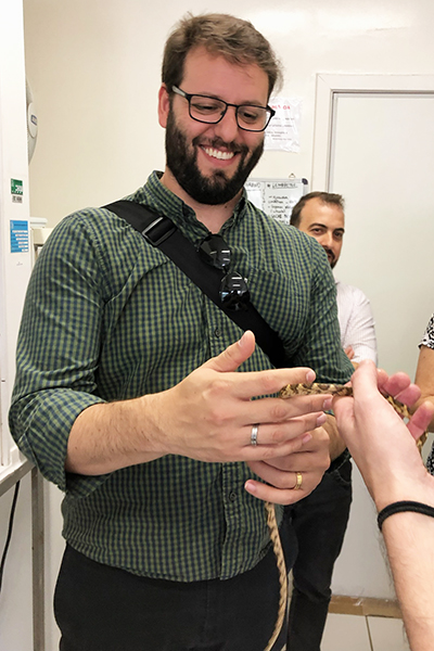 man holding a snake