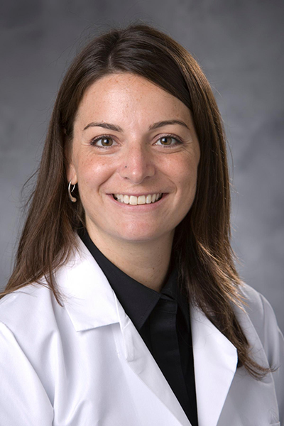 portrait of woman in white coat