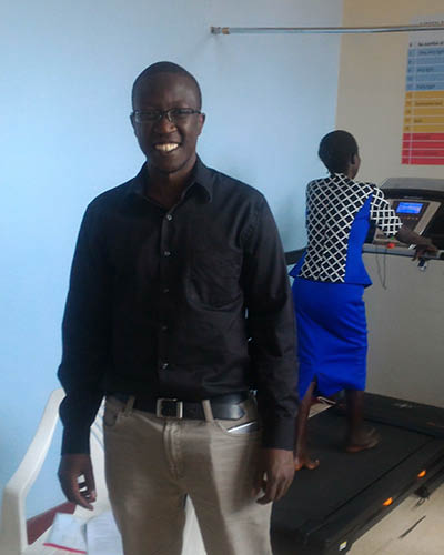 Titus Ng'eno with patient on a treadmill