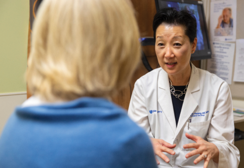 Dr. Hwang consulting with a patient