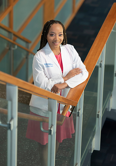 female medical student standing on stairs