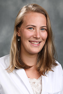 photo of woman wearing white coat