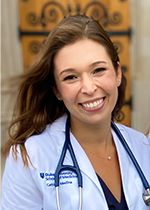 Headshot of student Cathlyn Medina wearing white coat and stethoscope in front of a wooden door
