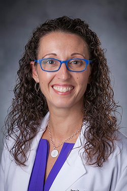 photo of woman in white coat