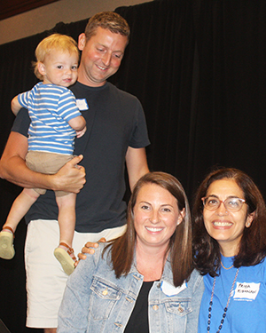 three adults and baby