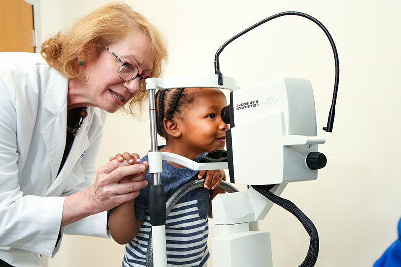 female physician with small child