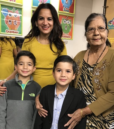 Svati Shah standing with her mother and two sons