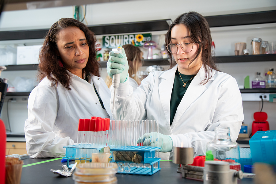 Asiya Gusa, PhD in her lab with a student