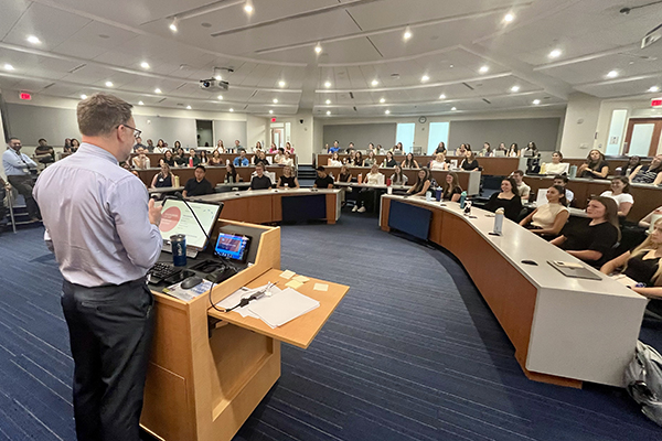 Dr. Hoder addressing Duke DPT students in a lecture hall