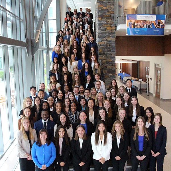 students posed on a set of stairs for a class photo