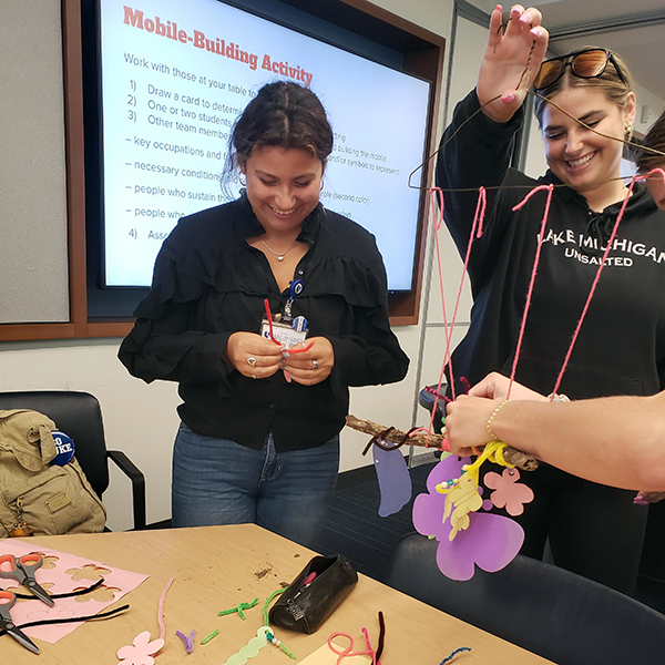 students using materials to build their mobile