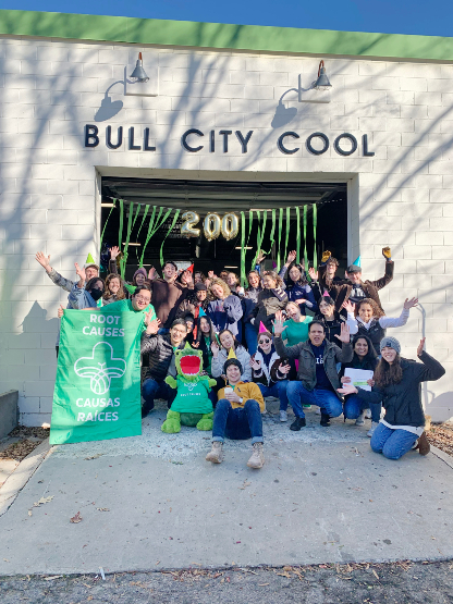 Student group outside building that says "Bull City Cool"