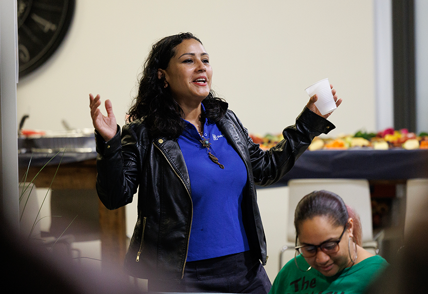 Program leader Alexandra Valladares welcomes everyone during BOOST’s 20th anniversary celebration