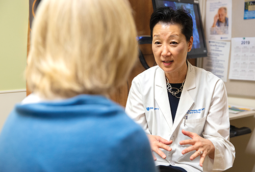 Dr. Shelley Hwang consulting with a patient.