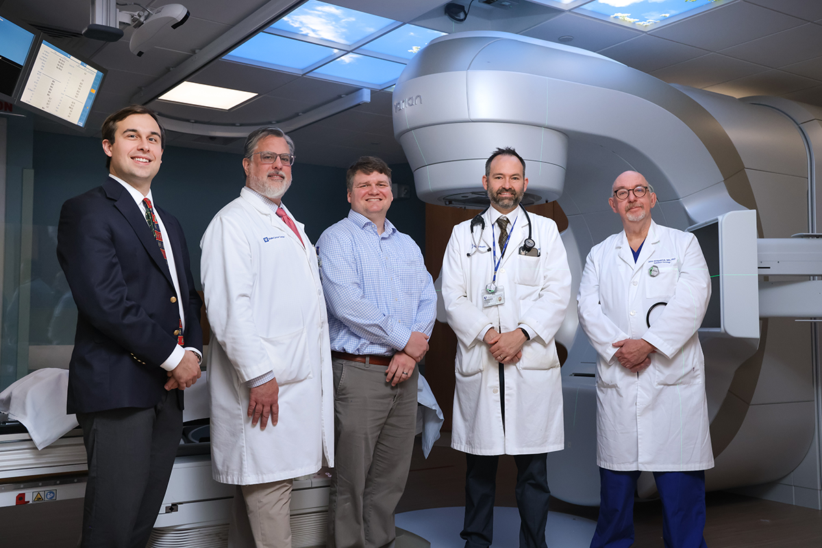Members of the Duke Center for Brain and Spine Metastases, from left Eugene Vaios, MD, MBA, radiation oncologist; Scott Floyd, MD, PhD, radiation oncology deputy director for research; Trey Mullikan, MD, radiation oncology deputy director for spine metastases; Zach Reitman, MD, PhD, radiation oncologist; and John Kirkpatrick, MD, PhD, radiation oncology director of the DCBSM.