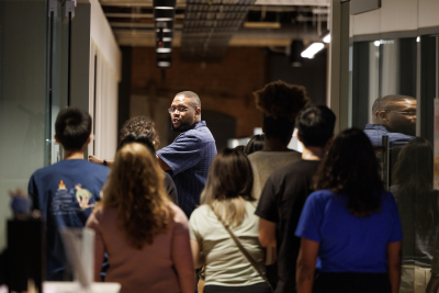 Ben Ncube leads a tour for new students in the population health sciences master's program in 2025.  