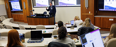 MMCi instructor teaching a class in a lecture hall