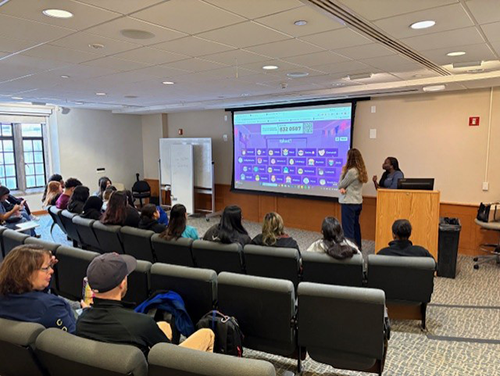 people in chairs in a lecture hall
