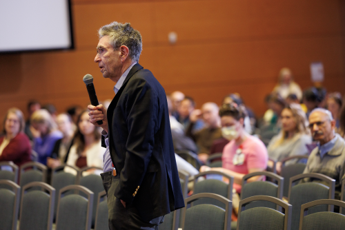 Robert J. Lefkowitz, MD, asks a question following one of the symposium’s lectures.