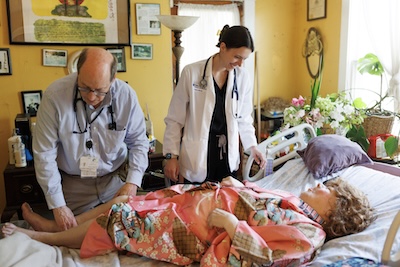 Dr. Eisenson and medical student caring for a patient. 