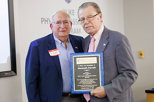 Ken Ferrell receiving award. Pictured with Gilbert R. Nelmes