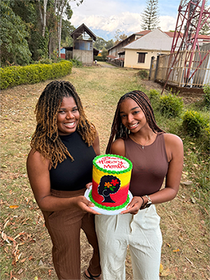Daren with classmate Kiera Brown, holding a cake that says ‘Black History Month.’