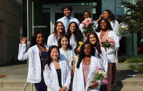 Hamed Akrami, top left, with classmates in front of the Trent Semans Center for Health Education.