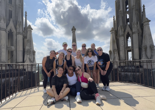 Holly Brown, second row second in from the left, with classmates at the top of the Duke Chapel tower.
