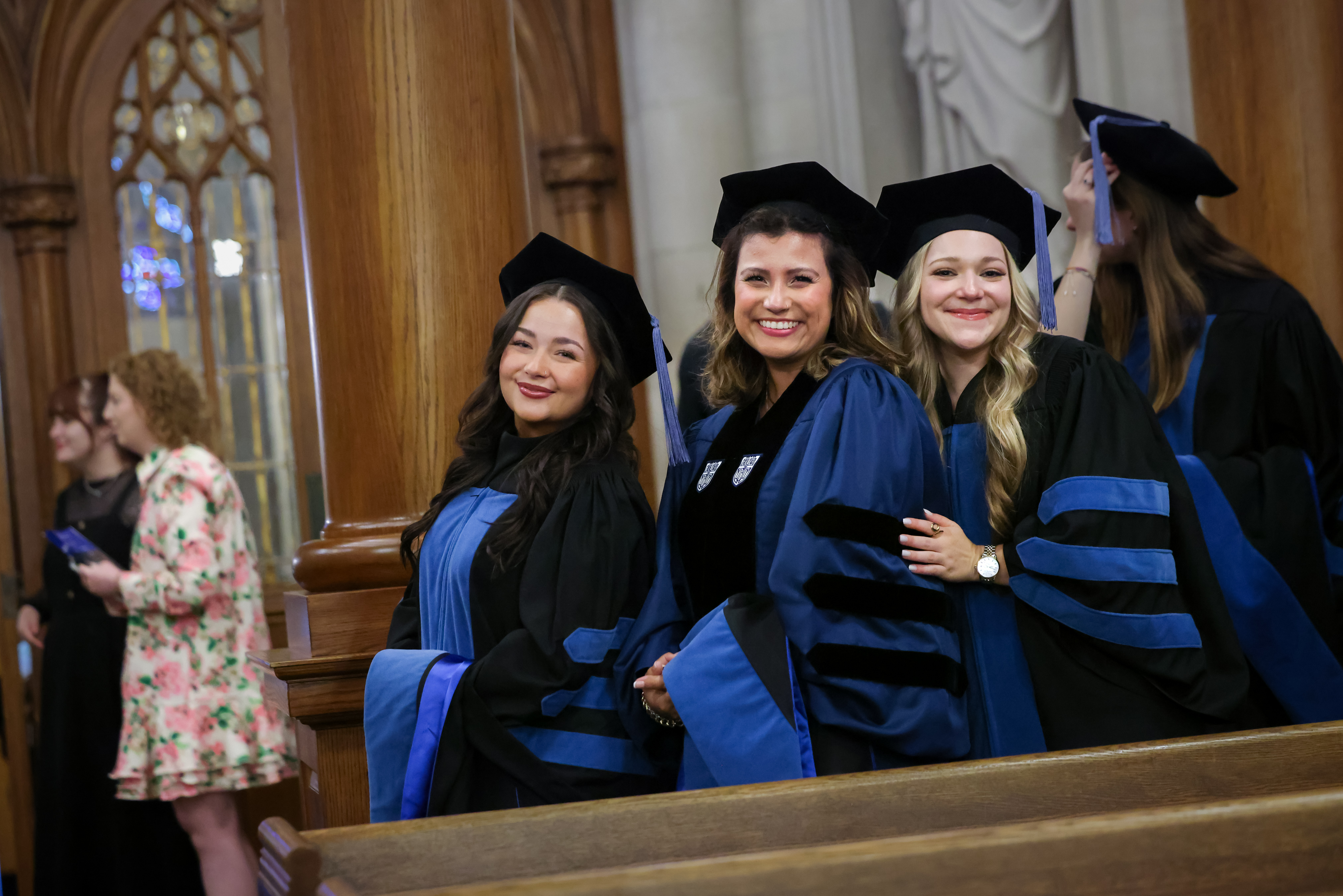 Three female members of the OTD class of 2026 pose for photo