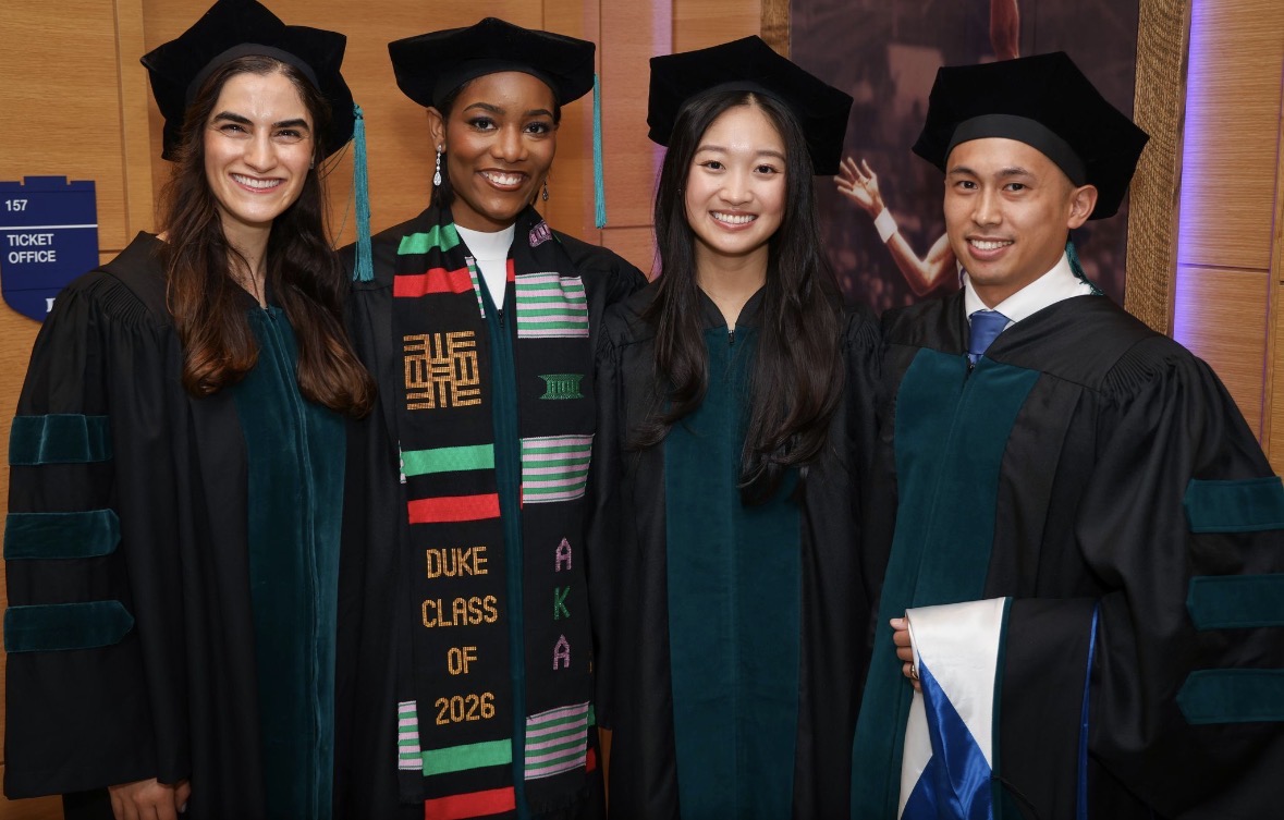 three female and one male DPT class of 2026 graduates
