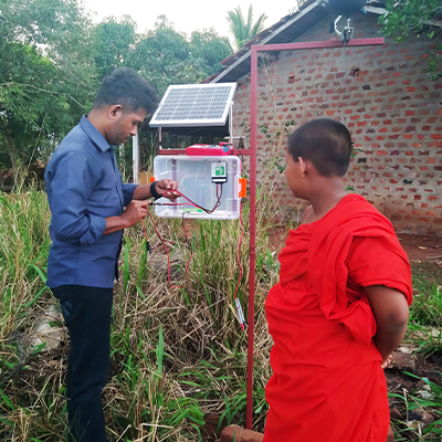 Researchers in the field recording data from solar powered instruments
