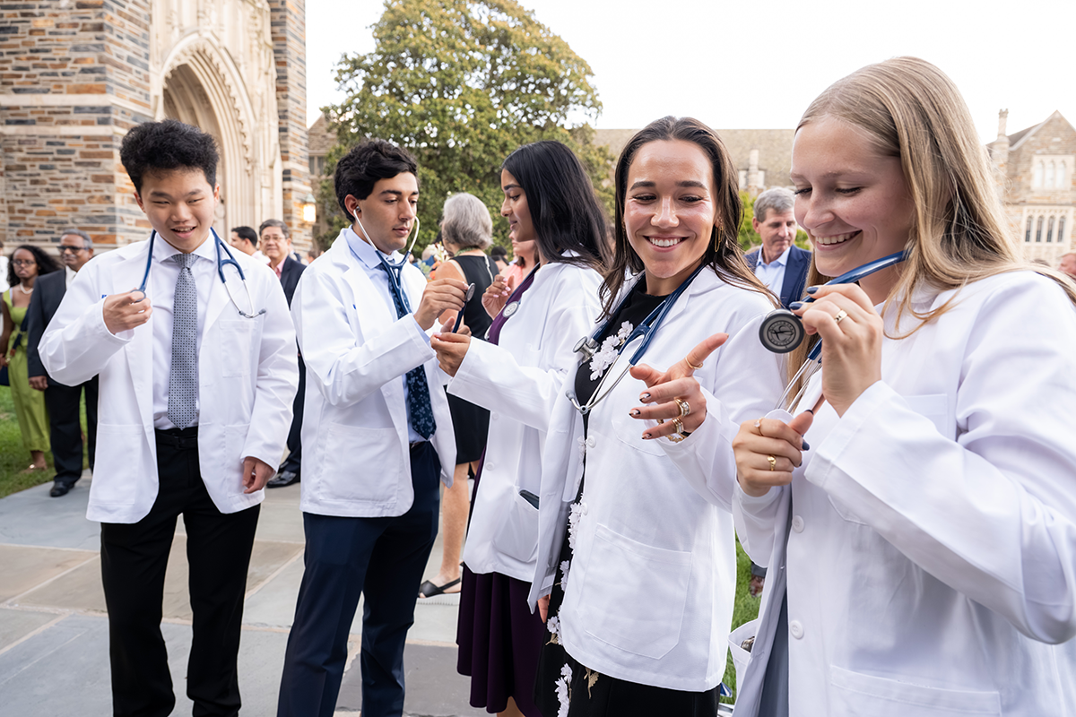 Students examining their new stethoscops after the ceremony. 