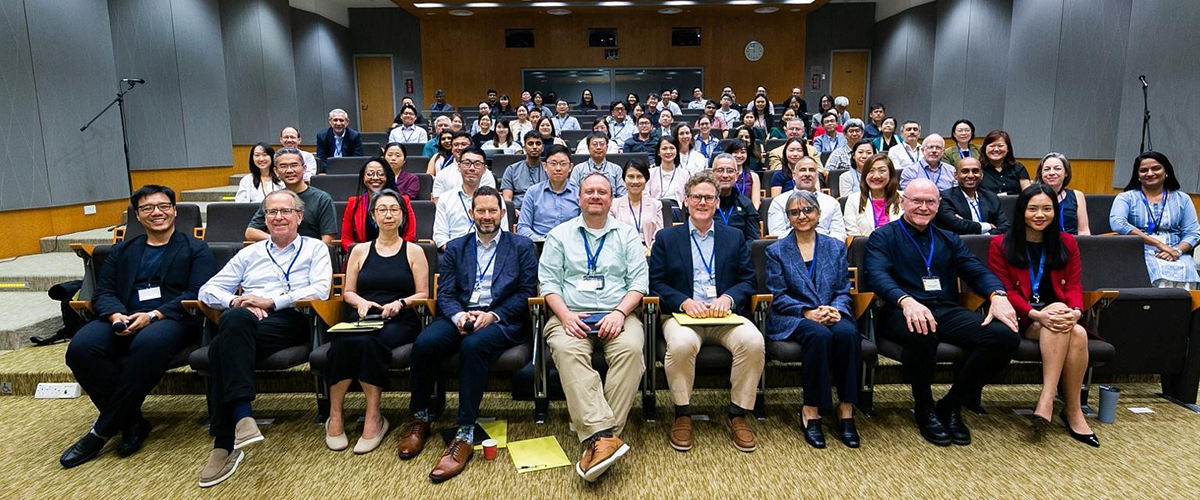 Image: Group photo of attendees seated and standing in a lecture hall during the Durham and Singapore Horizon (DASH) symposium at Duke-NUS Medical School.