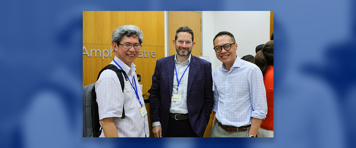 Image: Micah Luftig poses with Professors Cliburn Chan and Eng Eong Ooi at the DASH Symposium.