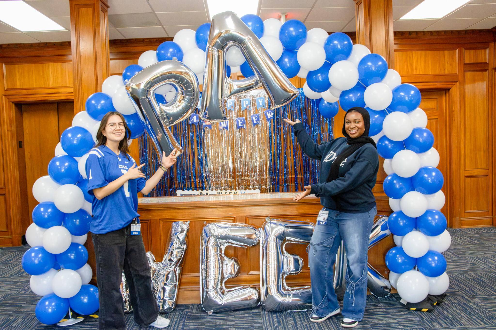 Duke PA Students standing by balloon arch.